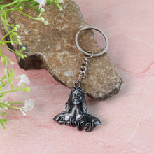 Metal keychain featuring Lord Shiva and Adiyogi designs