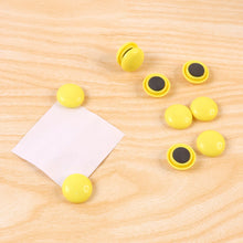Side profile of a white round magnet, highlighting its compact and sleek design.