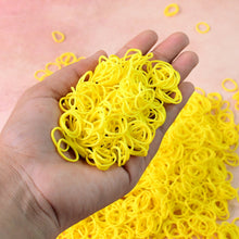 Bright orange elastic rubber bands bundled together