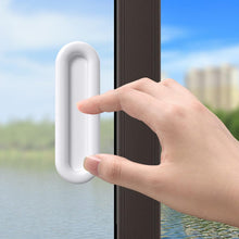 Close up of ergonomic self stick push pull helper installed on flat surface