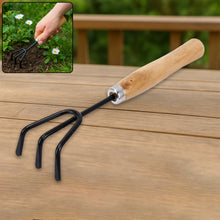Durable black steel hand cultivator for efficient gardening tasks.