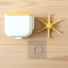 Sticky wall hook holding a lightweight bag securely on wall