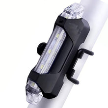 Rechargeable LED bicycle light with USB charging port for convenient power.