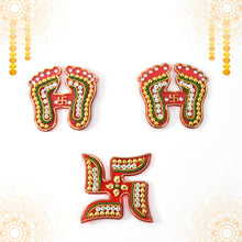 Assorted Laxmi Charan and Swastik decals in bright hues for Diwali décor