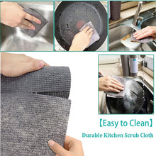 Microfiber dish cloth being rinsed under running water for easy cleaning.