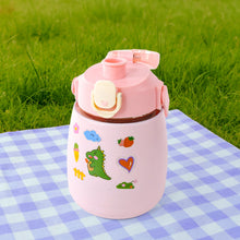 Insulated water bottle standing upright on a surface