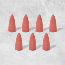 A pack of specialized backflow incense cones, essential for creating the smoke waterfall effect.