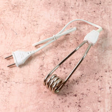 Portable immersion heater rod showing its compact design for travel