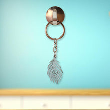 Elegant laser-cut peacock feather keychain accessory