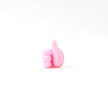 Side profile of pink silicone hand clip wall holder for organizing cables