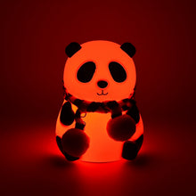 Rechargeable panda LED lamp on a bedside table, providing a gentle glow.