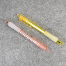 A pair of CustoPen ballpoint pens displayed with essential office stationery.