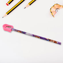 A purple Sofia the First pencil being sharpened by a pink sharpener, with pencil shavings and other pencils in the
