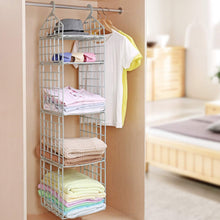 Grey 5-layer plastic hanging closet organizer filled with folded clothes and hats in a closet.