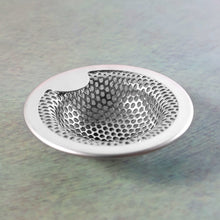 Kitchen sink strainer showing rust-resistant steel surface and holes