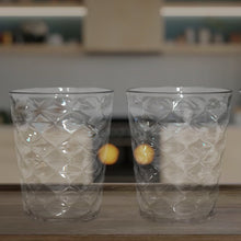 Side view of pyramid plastic glass showcasing wide stable base