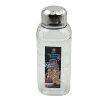 Transparent mukhwas bottle sitting on a kitchen counter with snacks