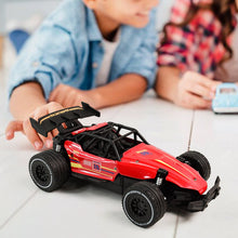Red RC race car showing action shot on rough terrain for kids
