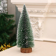 Miniature Christmas tree with snow-covered branches ideal for festive office decoration