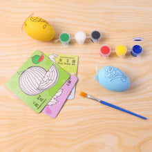 Children using creative painting set with colour cards and paint pots