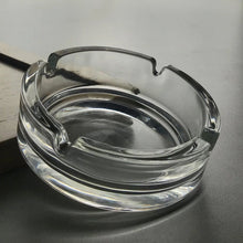 Durable crystal glass ashtray suitable for both indoor and outdoor use.
