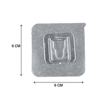 Multiple self-adhesive transparent hooks neatly organized on a surface.