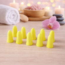 Foam ear plugs arranged neatly, ready for noise reduction use