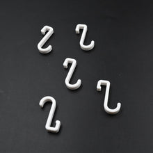 Multi-angle view of the strong self-adhesive plastic hook, highlighting its sleek design.