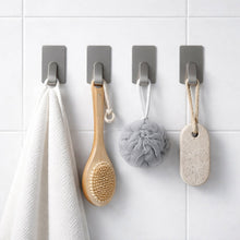 Close-up showing adhesive backing of wall hooks