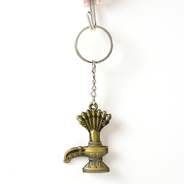 Close-up of Lord Shiva Shivaling metal keychain with detailed serpent design
