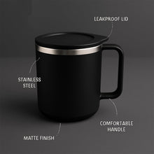 Close-up of the black insulated coffee mug, highlighting its sleek matte finish.