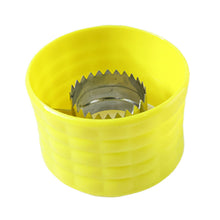 Handheld corn peeler tool shown while removing kernels manually