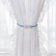 Set of two magnetic curtain tiebacks featuring pearl accents