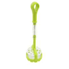 The versatile potato masher shown mashing sweet potatoes in a bowl.