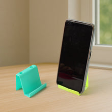 Durable plastic mobile stand showing non-slip base and pen holder compartments