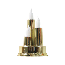 A golden triple LED flameless candle lamp with white flame-shaped bulbs on a plain white background.