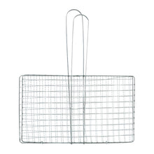 Grill basket flipped during outdoor barbecuing for easy handling
