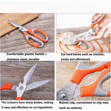 A pair of multi-function kitchen scissors with a magnetic holder against a plain background.