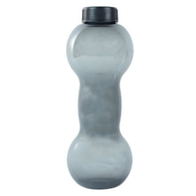 The FitFuzion dumbbell water bottle on a table, ready for your next gym session or daily hydration.
