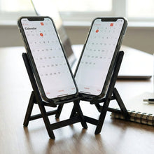 Foldable mini chair mobile phone stand with smartphone placed on it