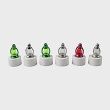 Battery-operated LED candle lights with decorative lantern-style covers