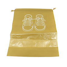 Compact folded waterproof shoe bag next to a pair of shoes, highlighting its portability.