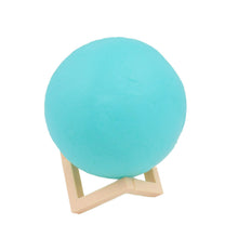 The Moon Night Lamp's durable plastic stand provides stable support for the spherical light.