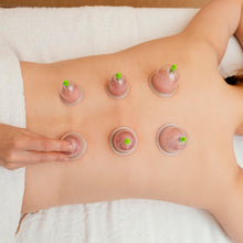 Cupping therapy set with suction pumps.