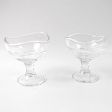 Clear glass dessert bowl highlighting its sturdy footed base.