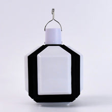 Portable camping LED light shown folded for easy travel and storage