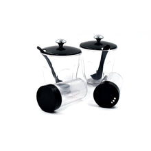 An Indian kitchen countertop featuring the Ganesh Spice Condiment Set for daily cooking.