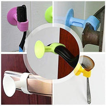 A collage of five images showing the silicone suction cup being used to hold various items like a toothbrush and spoon.