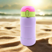 Push-button cap reveals a flexible silicone straw for easy sipping from the bottle.