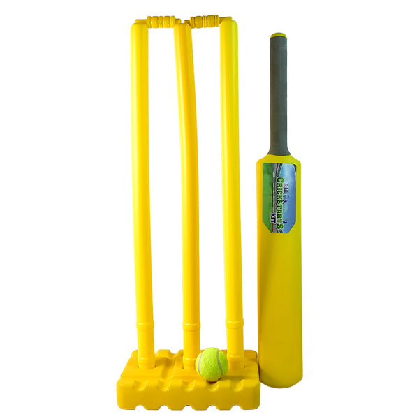 Joyful child playing cricket outdoors with a plastic junior cricket bat and ball.